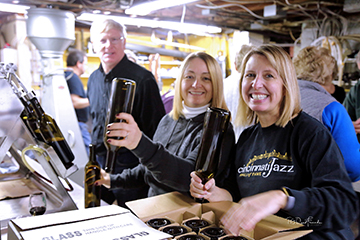 volunteers bottling in cellar